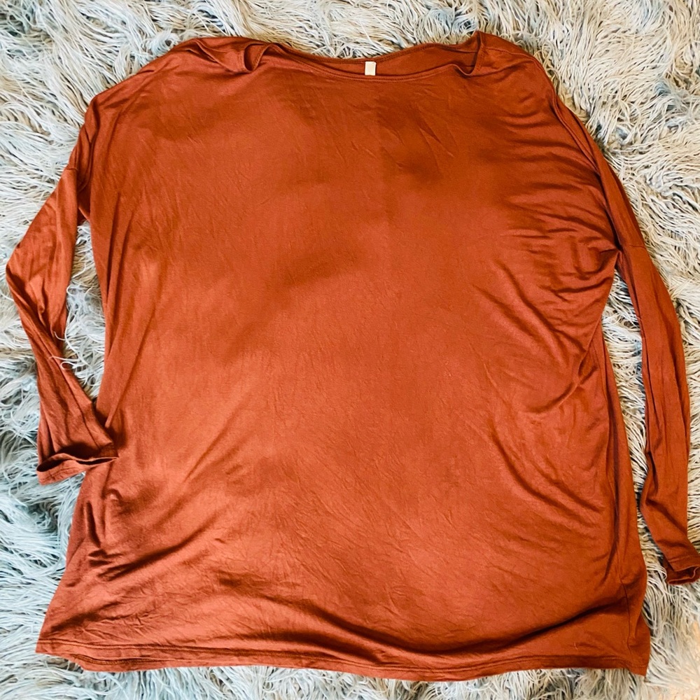 Rust colored tunic. Soft thin material. Size large